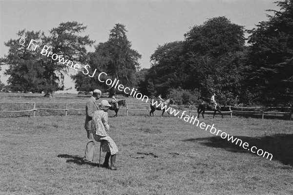 AT CASTLETOWN CHILDREN RIDING PATRICK JUMPING RIDING ON THE RING LADY CAREW & COL LEWIS JUDGING